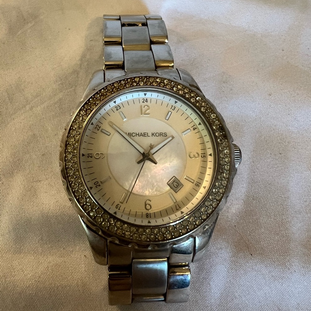 Michael Kors Silver Watch with Crystal Bezel and mother of pearl face.
